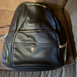 Classic Black Pebbled Backpack with Gold Accents